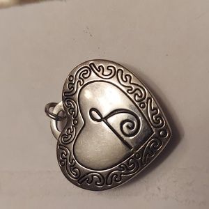 Magnetic locket heart pendant.